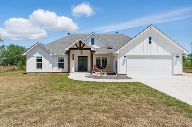 modern farmhouse style home featuring a garage, concrete driveway, board and batten siding, a shingled roof, and a front yard