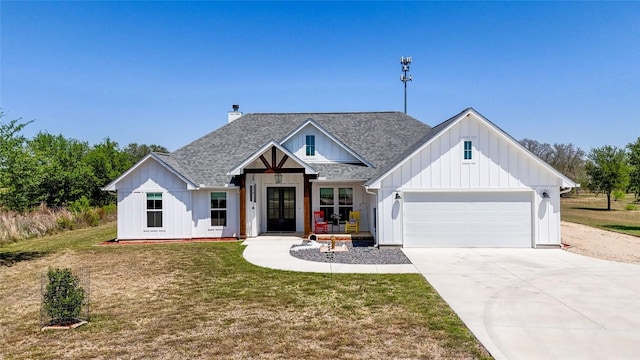 modern farmhouse style home with french doors, roof with shingles, driveway, an attached garage, and board and batten siding