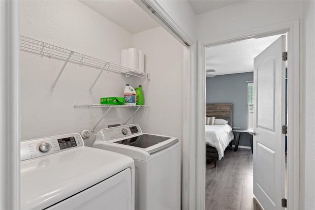 6801 Campina Xing, Del Valle, TX 78617 - laundry room with washer and clothes dryer and wood finished floors