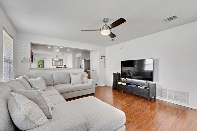 6801 Campina Xing, Del Valle, TX 78617 - living area with wood finished floors and ceiling fan