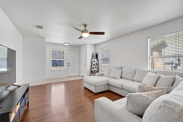 6801 Campina Xing, Del Valle, TX 78617 - living room with ceiling fan and wood finished floors