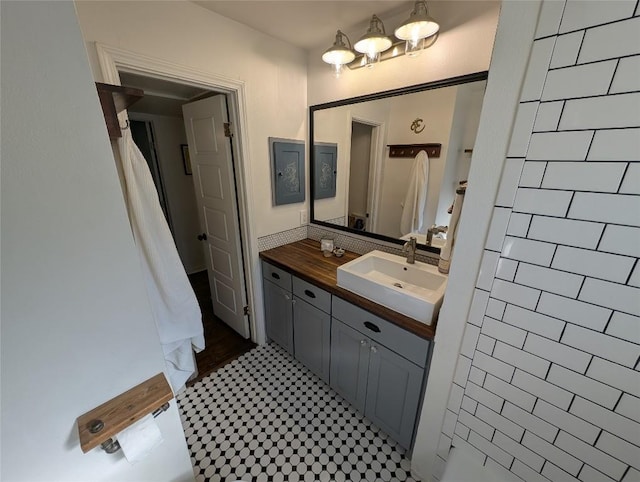307 Swanee Dr, Austin, TX 78752 - full bath featuring vanity, a chandelier, and tile patterned floors