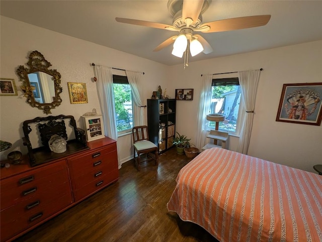 bedroom featuring dark wood-style flooring and ceiling fan