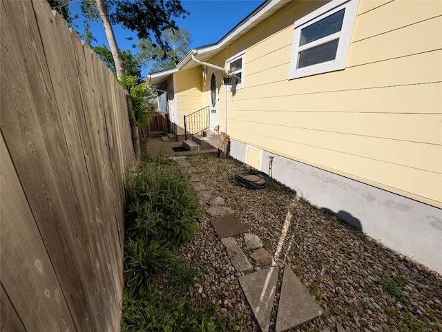 view of side of property with fence