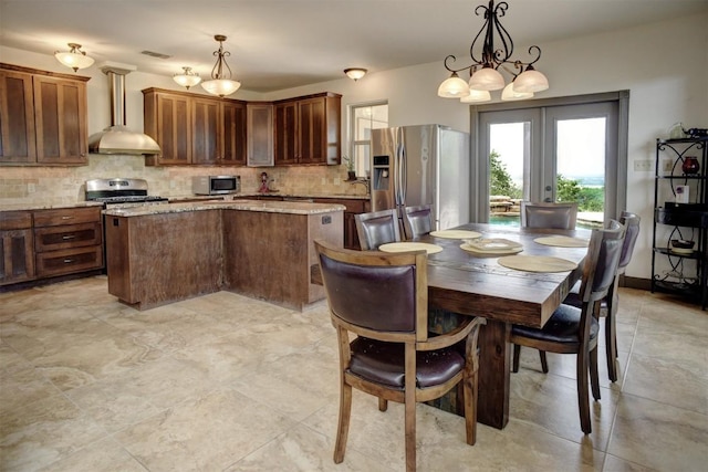 134 River Forest Dr, Bastrop, TX 78602 - dining space featuring french doors and a chandelier