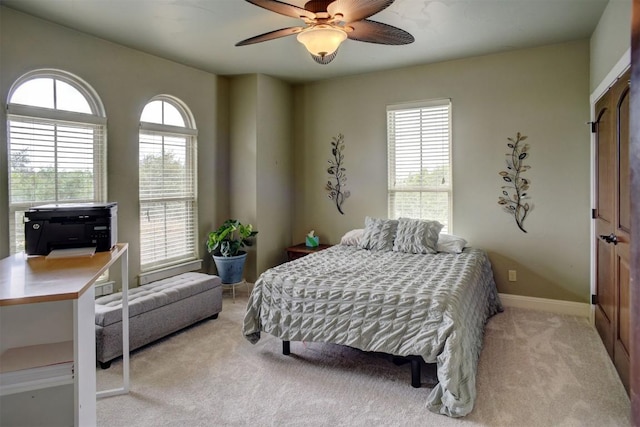 134 River Forest Dr, Bastrop, TX 78602 - bedroom featuring light colored carpet, ceiling fan, and baseboards