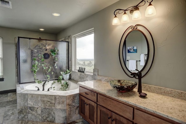 134 River Forest Dr, Bastrop, TX 78602 - full bath featuring vanity, a bath, a shower stall, and recessed lighting