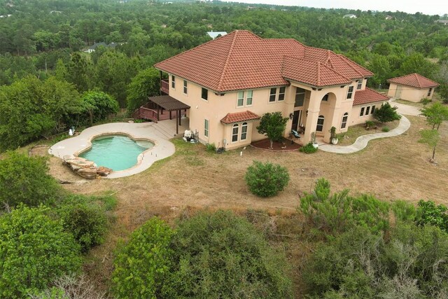 134 River Forest Dr, Bastrop, TX 78602 - view from above of property featuring a heavily wooded area and a pool