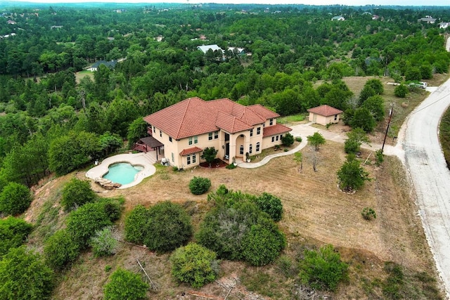 134 River Forest Dr, Bastrop, TX 78602 - view from above of property featuring a forest and a pool area