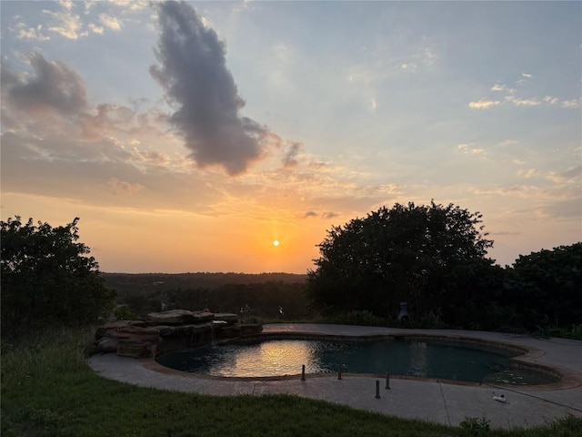 134 River Forest Dr, Bastrop, TX 78602 - pool at dusk with an outdoor pool