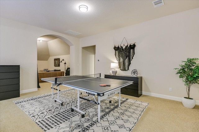 8813 Fescue Ln, Austin, TX 78738 - playroom with light colored carpet, arched walkways, and baseboards
