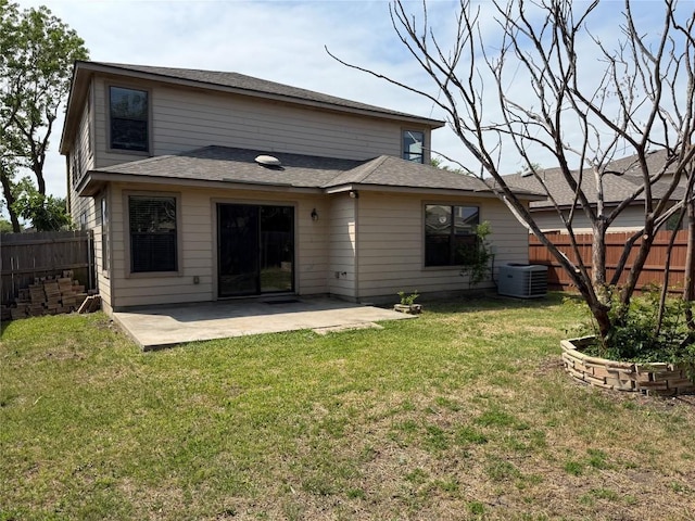 rear view of property with a fenced backyard, central AC, a patio, and a lawn