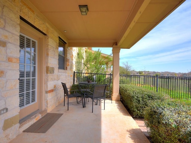 view of patio featuring fence