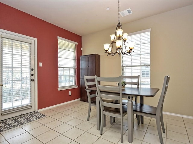 dining room with baseboards, visible vents, a notable chandelier, and light tile patterned floors
