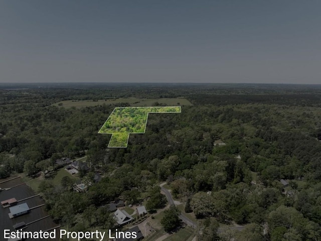 aerial view featuring a forest view