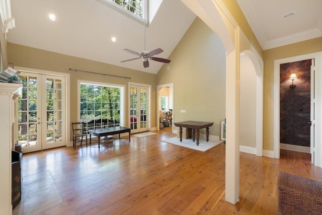 interior space featuring arched walkways and french doors