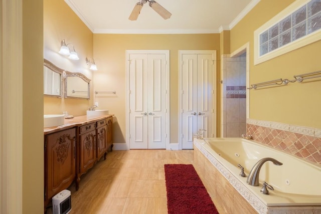 bathroom featuring a whirlpool tub, a ceiling fan, vanity, and crown molding