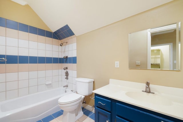 bathroom featuring toilet, bathtub / shower combination, lofted ceiling, tile patterned flooring, and vanity