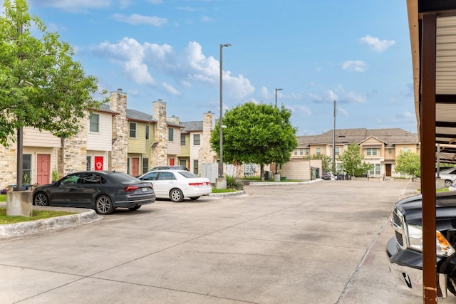 6900 E Riverside Dr Unit 24, Austin, TX 78741 - uncovered parking lot with a residential view