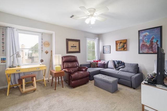 6900 E Riverside Dr Unit 24, Austin, TX 78741 - carpeted living room featuring a ceiling fan and baseboards
