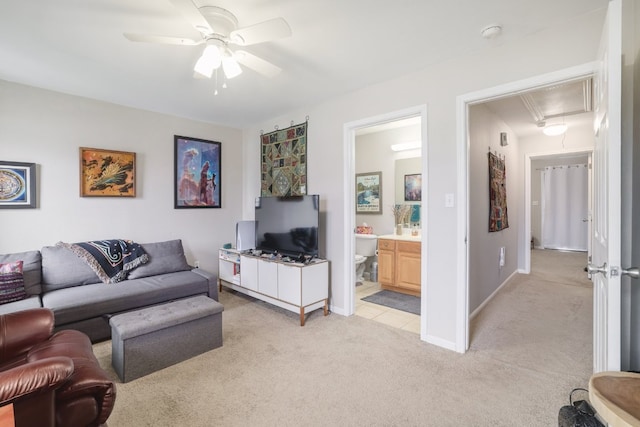 6900 E Riverside Dr Unit 24, Austin, TX 78741 - living room with attic access, light colored carpet, and ceiling fan