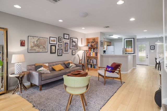 6900 E Riverside Dr Unit 24, Austin, TX 78741 - living room with recessed lighting, light wood-type flooring, and visible vents
