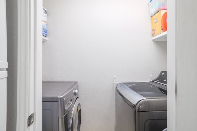 6900 E Riverside Dr Unit 24, Austin, TX 78741 - clothes washing area featuring washing machine and dryer and laundry area