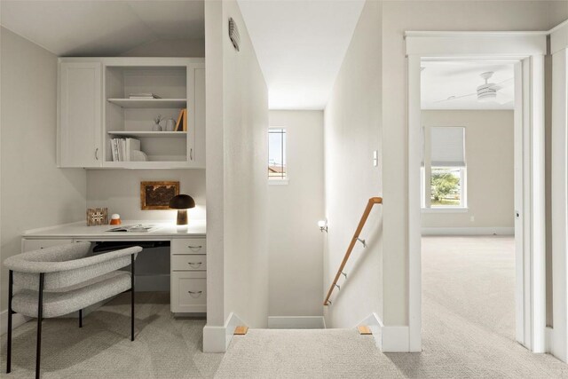 office area featuring visible vents, light carpet, built in study area, and a wealth of natural light