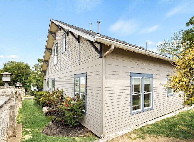 view of property exterior featuring a yard