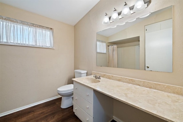 bathroom with wood finished floors, vanity, baseboards, toilet, and a shower with shower curtain
