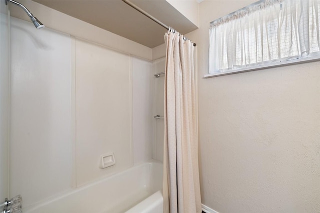 full bath featuring shower / tub combo with curtain