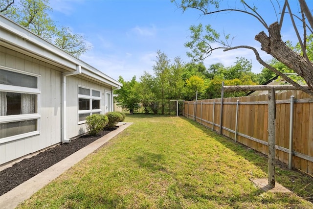 view of yard with a fenced backyard