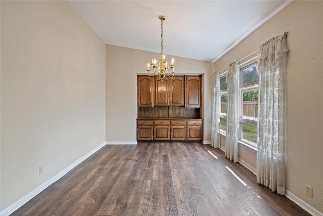 unfurnished dining area with vaulted ceiling, baseboards, dark wood-style flooring, and an inviting chandelier