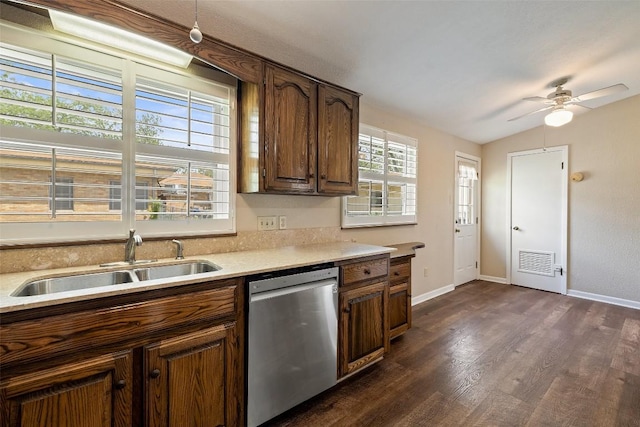 1310 Thompson St, Taylor, TX 76574 - kitchen with dishwasher, dark wood finished floors, light countertops, lofted ceiling, and ceiling fan
