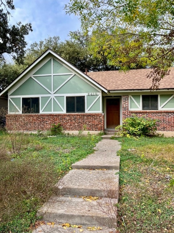 6410 Middleham Pl, Austin, TX 78745 - ranch-style home with brick siding and a shingled roof