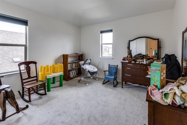 living area featuring carpet floors