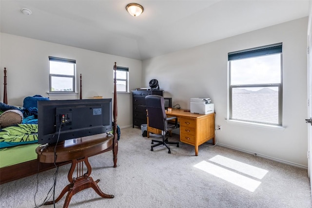 carpeted home office featuring baseboards