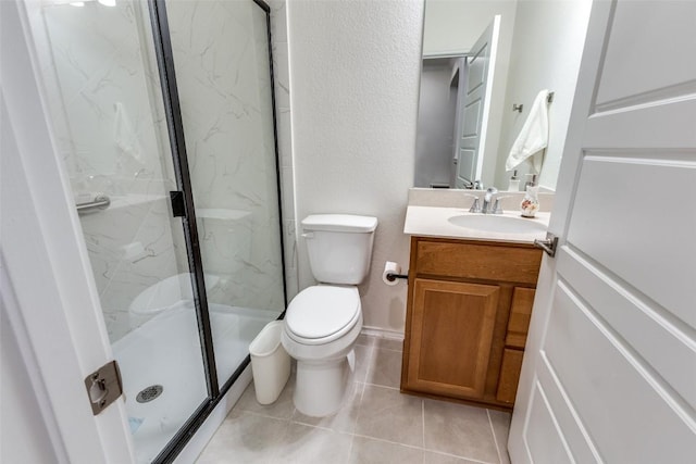 full bath with tile patterned flooring, toilet, vanity, and a marble finish shower