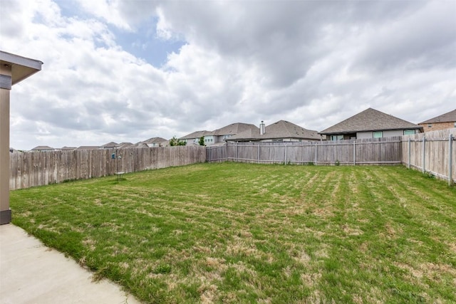 view of yard featuring a fenced backyard