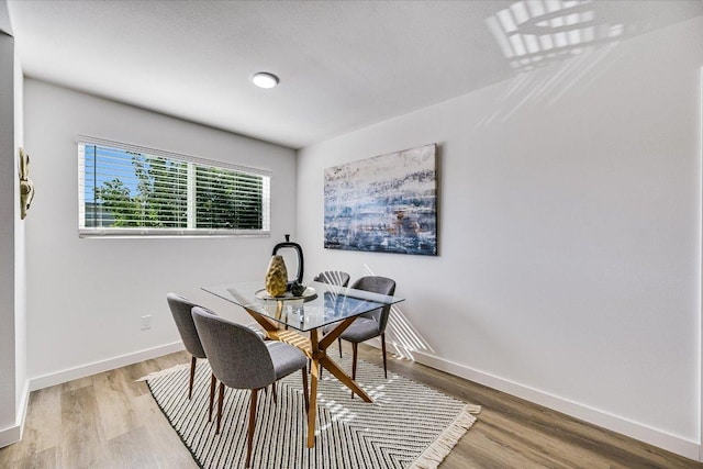 3703 Harmon Ave Unit 205, Austin, TX 78705 - dining space featuring wood finished floors and baseboards