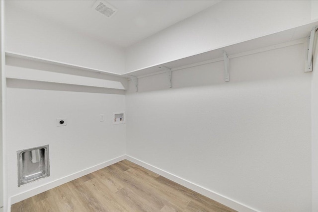 3703 Harmon Ave Unit 205, Austin, TX 78705 - laundry area with washer hookup, baseboards, light wood-type flooring, and electric dryer hookup