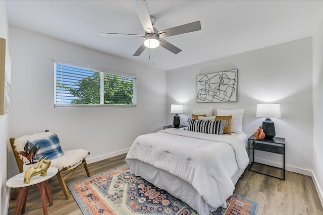 3703 Harmon Ave Unit 205, Austin, TX 78705 - bedroom with baseboards, wood finished floors, and ceiling fan
