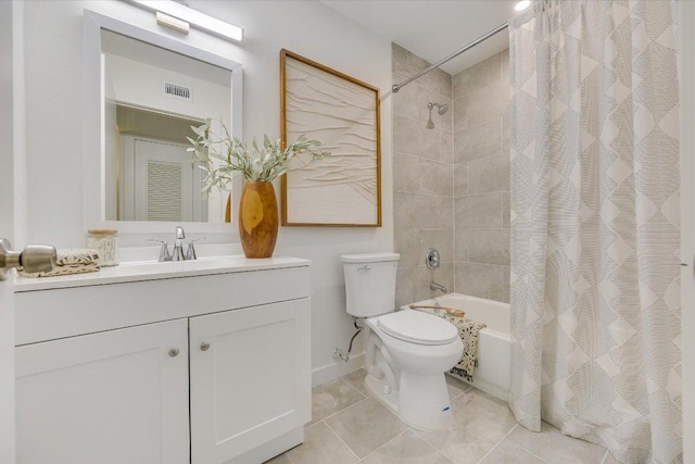 3703 Harmon Ave Unit 205, Austin, TX 78705 - full bath featuring shower / bathtub combination with curtain, toilet, vanity, tile patterned flooring, and baseboards