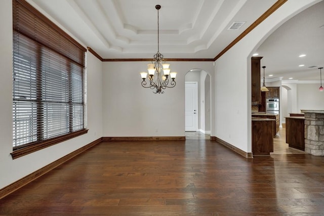 116 San Salvadore Dr, Canyon Lake, TX 78133 - empty room with arched walkways, dark wood-type flooring, a chandelier, a tray ceiling, and crown molding