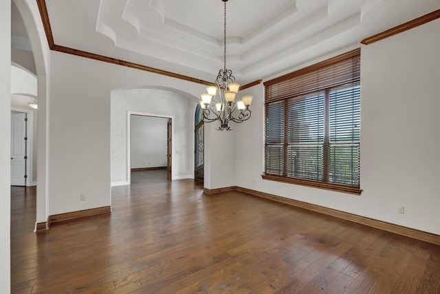 116 San Salvadore Dr, Canyon Lake, TX 78133 - spare room featuring arched walkways, a chandelier, a tray ceiling, hardwood / wood-style flooring, and baseboards
