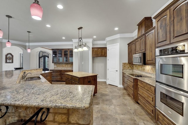 116 San Salvadore Dr, Canyon Lake, TX 78133 - kitchen with arched walkways, stainless steel appliances, a large island, a sink, and crown molding
