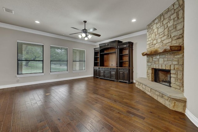 116 San Salvadore Dr, Canyon Lake, TX 78133 - unfurnished living room with ceiling fan, dark wood-style floors, baseboards, a fireplace, and crown molding