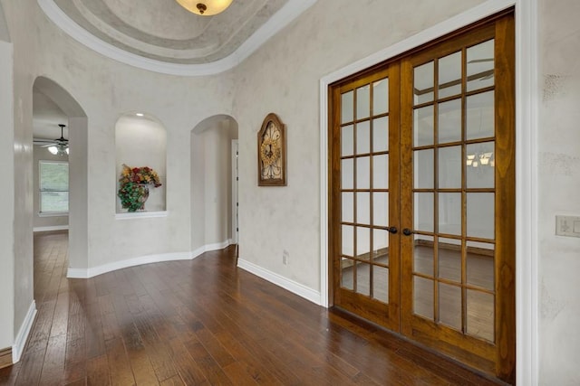 116 San Salvadore Dr, Canyon Lake, TX 78133 - unfurnished room with french doors, hardwood / wood-style floors, ceiling fan, arched walkways, and crown molding