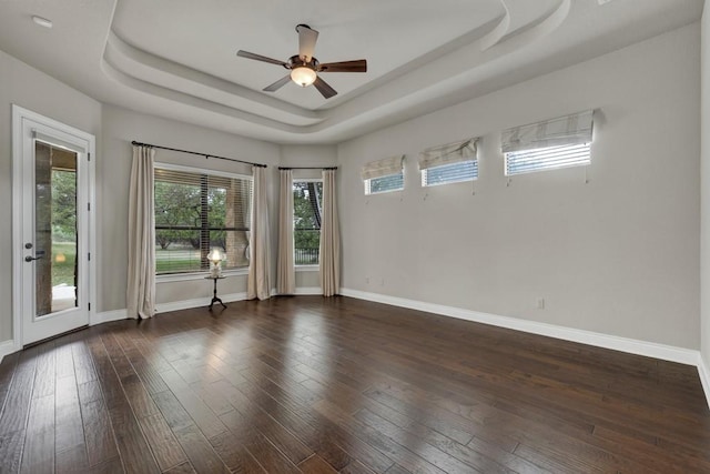 116 San Salvadore Dr, Canyon Lake, TX 78133 - unfurnished room with a raised ceiling, a ceiling fan, hardwood / wood-style flooring, and baseboards