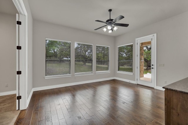116 San Salvadore Dr, Canyon Lake, TX 78133 - unfurnished room with healthy amount of natural light, ceiling fan, dark wood-type flooring, and baseboards